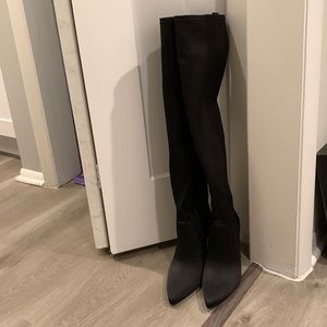Black satin polyester over the knee boot.